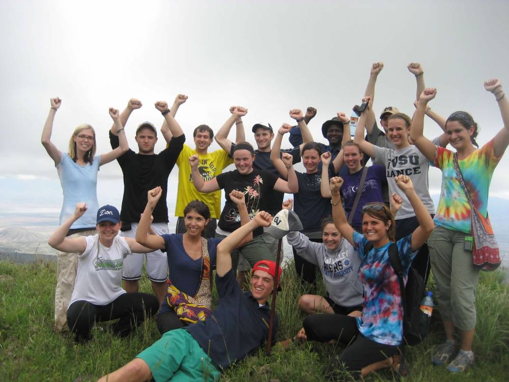 group of gvsu study abroad students with arms raised